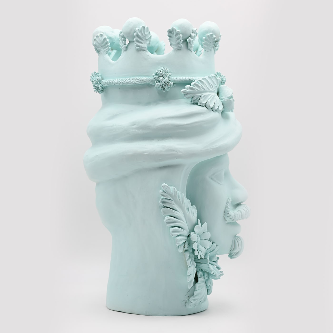 Maure‑Kopf himmelblaue Skulptur