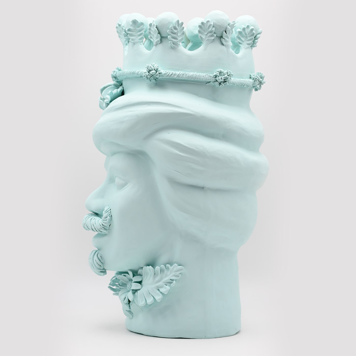 Maure‑Kopf himmelblaue Skulptur
