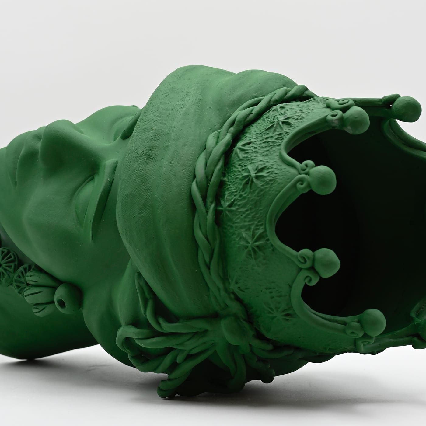 Maure‑Kopf grüne Skulptur