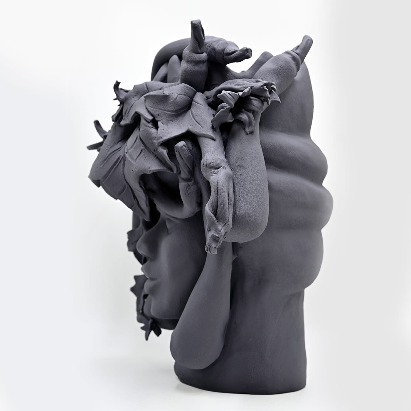 Maure‑Kopf graue Skulptur
