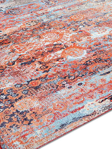 Woods Hellblau auf Kupfer‑Orange Teppich
