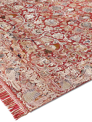 Original auf Rot-Orange-Mix Teppich