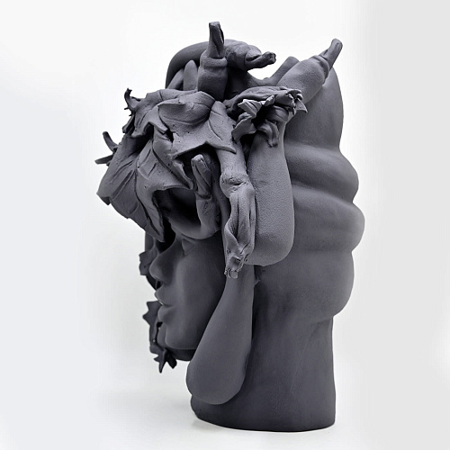 Maure‑Kopf graue Skulptur